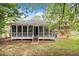 View of a cozy screened porch at the back of the house, perfect for outdoor relaxation at 2078 Olive Springs Se Rd, Marietta, GA 30060