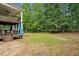 Multi-level deck overlooks the backyard, offering ample space for outdoor entertaining and relaxation at 300 Summer Pond Trl, Lawrenceville, GA 30046