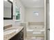 Bathroom with a vanity and a soaking tub at 300 Summer Pond Trl, Lawrenceville, GA 30046