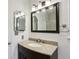 Bright bathroom featuring a dark vanity with a granite countertop at 300 Summer Pond Trl, Lawrenceville, GA 30046