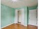 This bedroom features hardwood floors, a closet, and white walls at 300 Summer Pond Trl, Lawrenceville, GA 30046