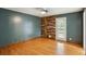 Bedroom with hardwood floors and a door to the deck at 300 Summer Pond Trl, Lawrenceville, GA 30046