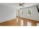 Cozy living room with hardwood floors, bright windows, and access to the home's entry and hallway at 300 Summer Pond Trl, Lawrenceville, GA 30046