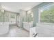 Bathroom with double sinks, large window and soaking tub at 3123 Morgan Box Ln, Buford, GA 30519