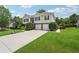 Charming two-story home with brick and siding and a well-manicured lawn and a basketball hoop at 3123 Morgan Box Ln, Buford, GA 30519