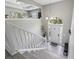 Inviting foyer with wood-look flooring, staircase, and arched doorway at 3123 Morgan Box Ln, Buford, GA 30519