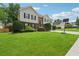 Charming two-story home with brick and siding, arched front door, manicured lawn, and a basketball hoop at 3123 Morgan Box Ln, Buford, GA 30519
