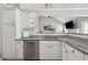 Bright and airy kitchen features granite countertops, stainless steel appliances, and a modern design at 3123 Morgan Box Ln, Buford, GA 30519