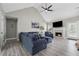 Spacious living room features a fireplace, vaulted ceiling, and modern finishes at 3123 Morgan Box Ln, Buford, GA 30519