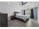 Spacious main bedroom features trey ceiling, ceiling fan, wood floors and a large window for lots of natural light at 3123 Morgan Box Ln, Buford, GA 30519