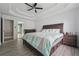 Large main bedroom with wood floors featuring an ensuite bathroom at 3123 Morgan Box Ln, Buford, GA 30519