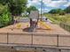 Community playground features a climbing wall, slide, and swings surrounded by mature trees at 3123 Morgan Box Ln, Buford, GA 30519