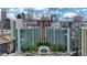 Stunning aerial view of high-rise condo buildings with a pool and vibrant cityscape at 44 Peachtree Nw Pl # 1728, Atlanta, GA 30309
