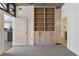 Bedroom with built in bookshelf, large closet, and doorways to the bathroom and kitchen at 44 Peachtree Nw Pl # 1728, Atlanta, GA 30309