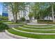 Inviting outdoor space featuring ample seating, lush landscaping, and city views at 44 Peachtree Nw Pl # 1728, Atlanta, GA 30309