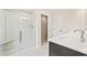 Bathroom with a walk-in shower featuring glass doors, a built-in bench, and double sinks at 4523 Moray Dr, Mableton, GA 30126