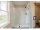 Bathroom features a walk-in shower with a glass door and modern fixtures at 4523 Moray Dr, Mableton, GA 30126
