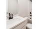 Bathroom featuring a white vanity, black hardware, and tiled floor at 4523 Moray Dr, Mableton, GA 30126