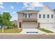 Charming townhome with brick and siding, pergola over garage, and well-manicured lawn at 4523 Moray Dr, Mableton, GA 30126