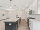 Modern kitchen with stainless steel appliances, large island, pendant lighting and open floor plan at 4523 Moray Dr, Mableton, GA 30126
