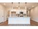Modern kitchen with a large island, stainless steel appliances, and pendant lighting at 4523 Moray Dr, Mableton, GA 30126