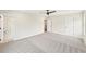 Large main bedroom featuring neutral carpet, a ceiling fan, and en suite bath at 4523 Moray Dr, Mableton, GA 30126