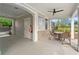 Outdoor seating area under the pool house overhang, offering a comfortable shaded retreat with fan and amenities at 4523 Moray Dr, Mableton, GA 30126