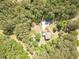 A high angle shot of a residence with mature trees surrounding on a parcel at 830 Hightower Trl, Oxford, GA 30054