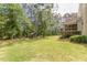 Large backyard featuring a shaded pergola with outdoor seating at 830 Hightower Trl, Oxford, GA 30054