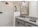 Modern bathroom with glass enclosed shower, granite countertops and rustic framed mirror at 830 Hightower Trl, Oxford, GA 30054