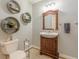 Stylish bathroom featuring a vanity, decorative shelves, and updated fixtures at 830 Hightower Trl, Oxford, GA 30054