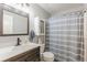 Bathroom featuring a shower, vanity, mirror and medicine cabinet at 830 Hightower Trl, Oxford, GA 30054