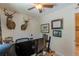 Bedroom turned office space with dual monitors, natural light, and unique decor at 830 Hightower Trl, Oxford, GA 30054