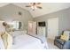 Bright bedroom with vaulted ceiling, fan, large window and neutral decor, with a TV at 830 Hightower Trl, Oxford, GA 30054