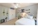 Cozy bedroom featuring a queen bed, ceiling fan, closet, and custom wall decor at 830 Hightower Trl, Oxford, GA 30054