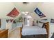 A carpeted bedroom includes sports decor, fan, window, dresser and ceiling fan at 830 Hightower Trl, Oxford, GA 30054