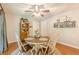 Cozy dining area features a round table, wood floors, and stylish decor for intimate meals at 830 Hightower Trl, Oxford, GA 30054