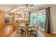 Open concept dining area seamlessly connects to kitchen and outdoor deck, ideal for entertaining at 830 Hightower Trl, Oxford, GA 30054