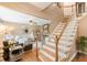 Warm and inviting foyer with hardwood floors and a staircase leading to the upper level at 830 Hightower Trl, Oxford, GA 30054