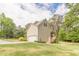 Spacious two-car garage and an additional outdoor shed for storage at 830 Hightower Trl, Oxford, GA 30054