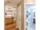 Hallway view showcasing access to the kitchen and a well-appointed half bathroom at 830 Hightower Trl, Oxford, GA 30054