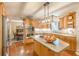 Kitchen with stainless appliances, granite countertops and an island with cooktop at 830 Hightower Trl, Oxford, GA 30054