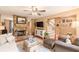 Inviting living room with stone fireplace, hardwood floors, and ample seating area at 830 Hightower Trl, Oxford, GA 30054