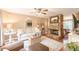 Cozy living room features a stone fireplace and neutral decor, creating a comfortable atmosphere at 830 Hightower Trl, Oxford, GA 30054