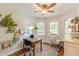 Bright home office with natural light, hardwood floors, and a comfortable seating area at 830 Hightower Trl, Oxford, GA 30054