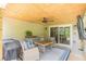 Covered porch with cozy seating and an outdoor dining area at 830 Hightower Trl, Oxford, GA 30054