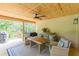 Relaxing covered porch with comfortable seating and wooded views at 830 Hightower Trl, Oxford, GA 30054