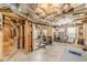 This unfinished basement space has exposed ceiling and framing, offering a blank canvas at 830 Hightower Trl, Oxford, GA 30054