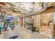 This unfinished basement space has exposed ceiling and framing, offering a blank canvas at 830 Hightower Trl, Oxford, GA 30054