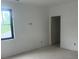 A bright and open unfinished bedroom with large windows offering scenic views, ready for customization at 1089 Mount Carmel Church Ln, Canton, GA 30114